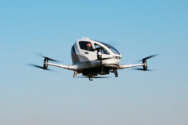 A drone-based flying taxi in midair.