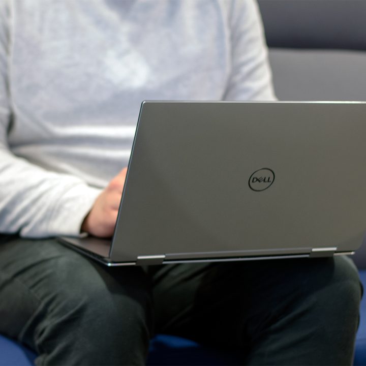 Dell's XPS 15 laptop being used on someone's lap.