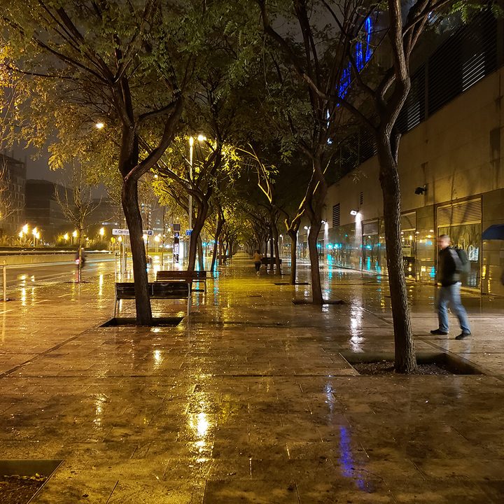 A rainy night in a city.