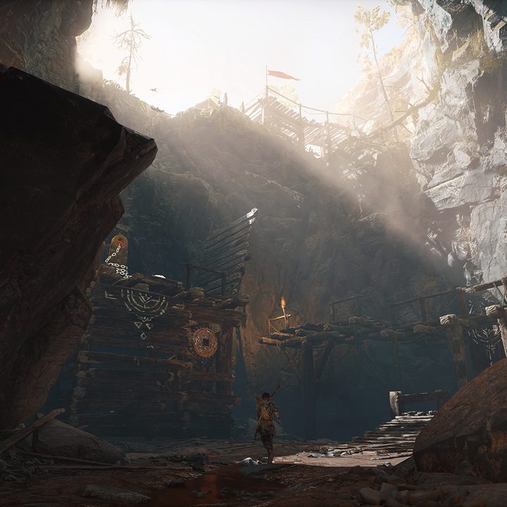 God of War Review | Atreus walking through a large forest ravine environment
