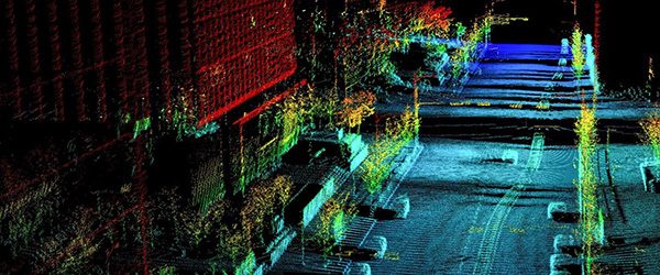 image of a city street with depth information displayed as colors.