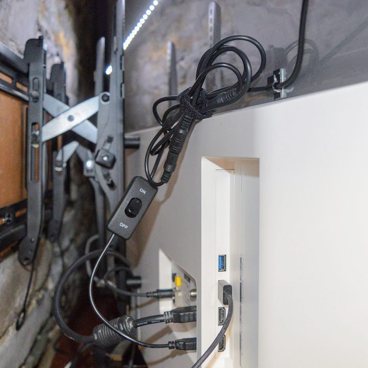 USB-powered bias lights shown behind a wall-mounted TV.