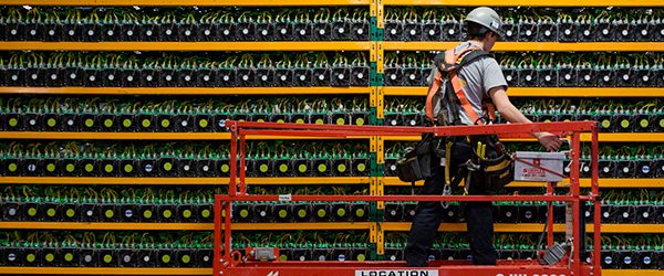 A cryptocurrency mining operation with rows of GPUs.