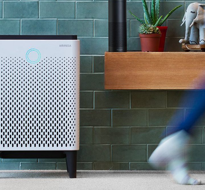 Person walking by an air purifier.