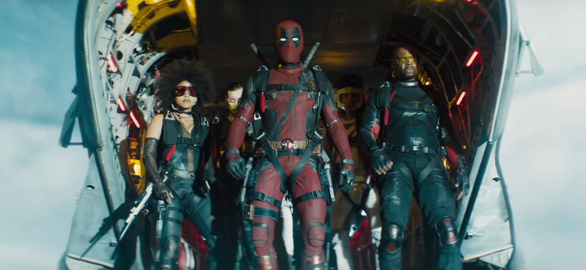Deadpool and the X-Force ready to jump out of a plane in Deadpool 2.