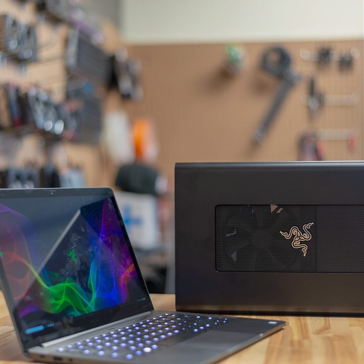 The Razer Core external GPU enclosure next to a Razer laptop