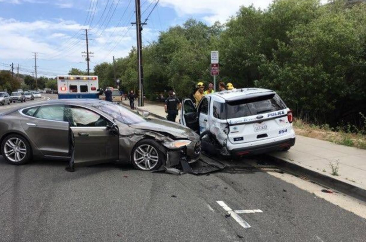 Tesla crashes into parked police car in California; driver says ...