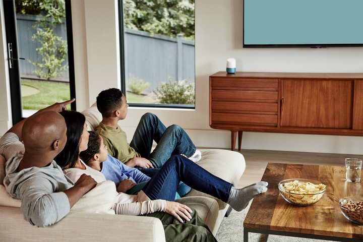 family watching tv with google home
