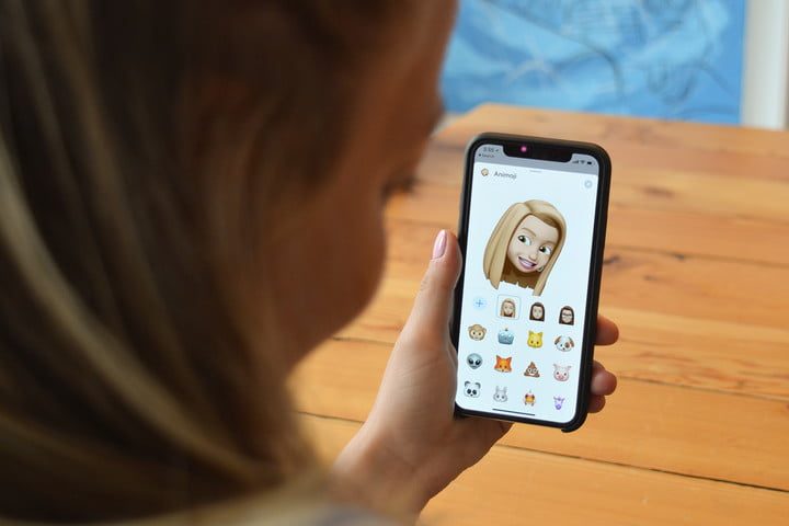A persona creating a Memoji on an iPhone running iOS 12.
