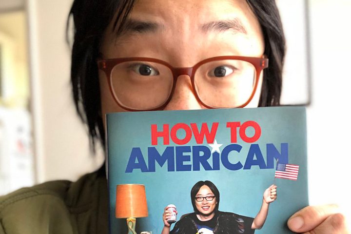 Jimmy O. Yang with book How to American