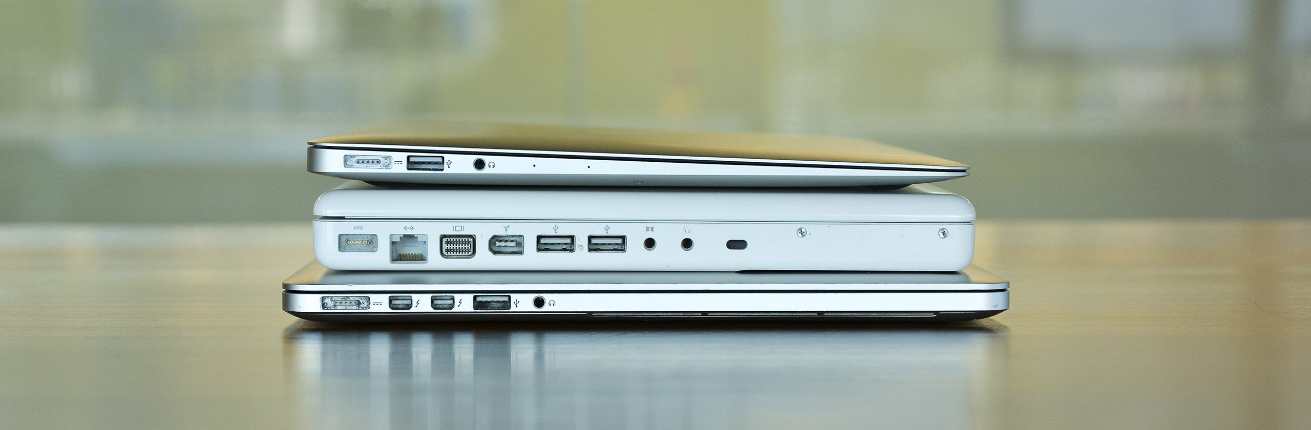 White Macbook between Macbook Pro and Macbook Air