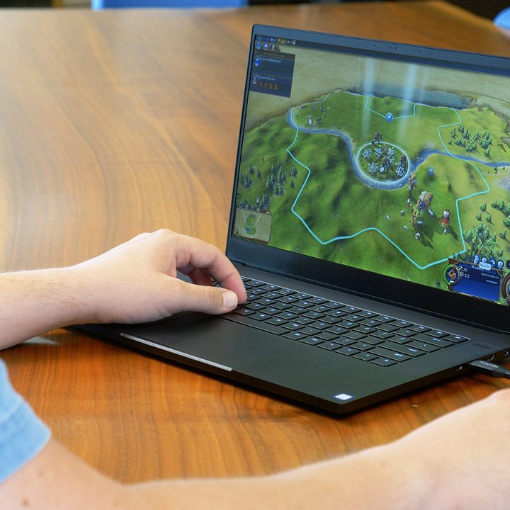 A person playing a game on a Razer Blade (2018).