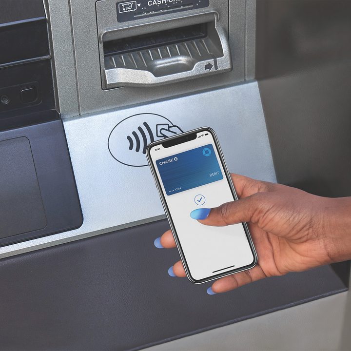 An iPhone using a tap-and-go payment kiosk.