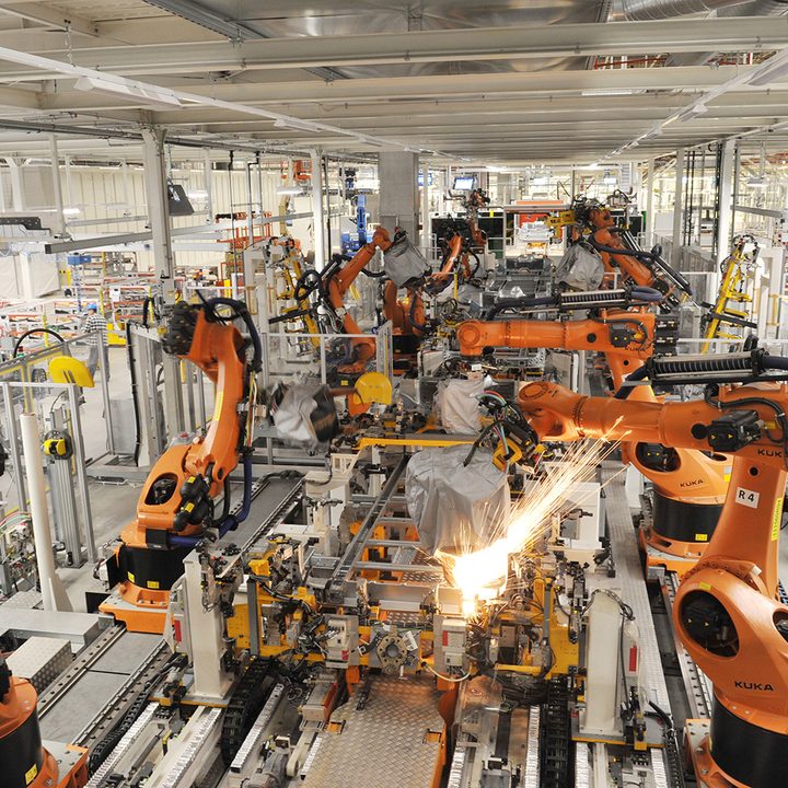 robotic arms in an automotive production line
