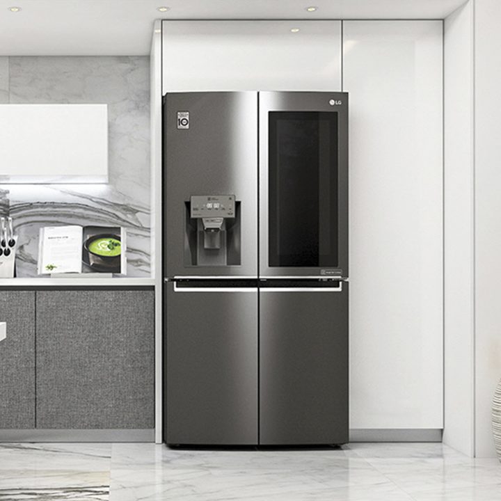 The LG Instaview Fridge in a high-end, white-and-gray kitchen.
