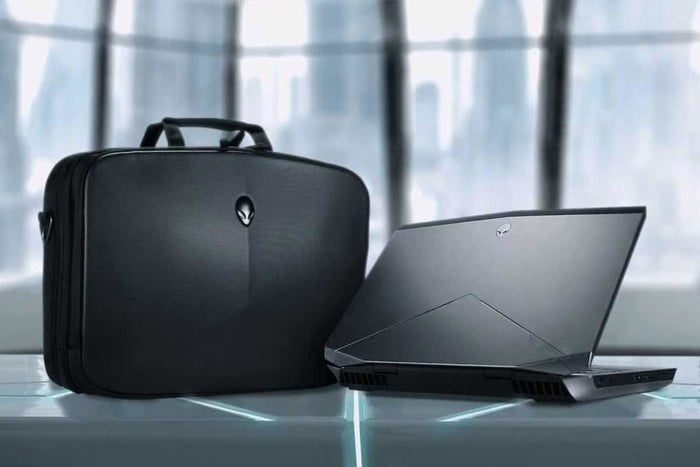 Mobile Edge Alienware Vindicator Briefcase sitting next to Alienware laptop.