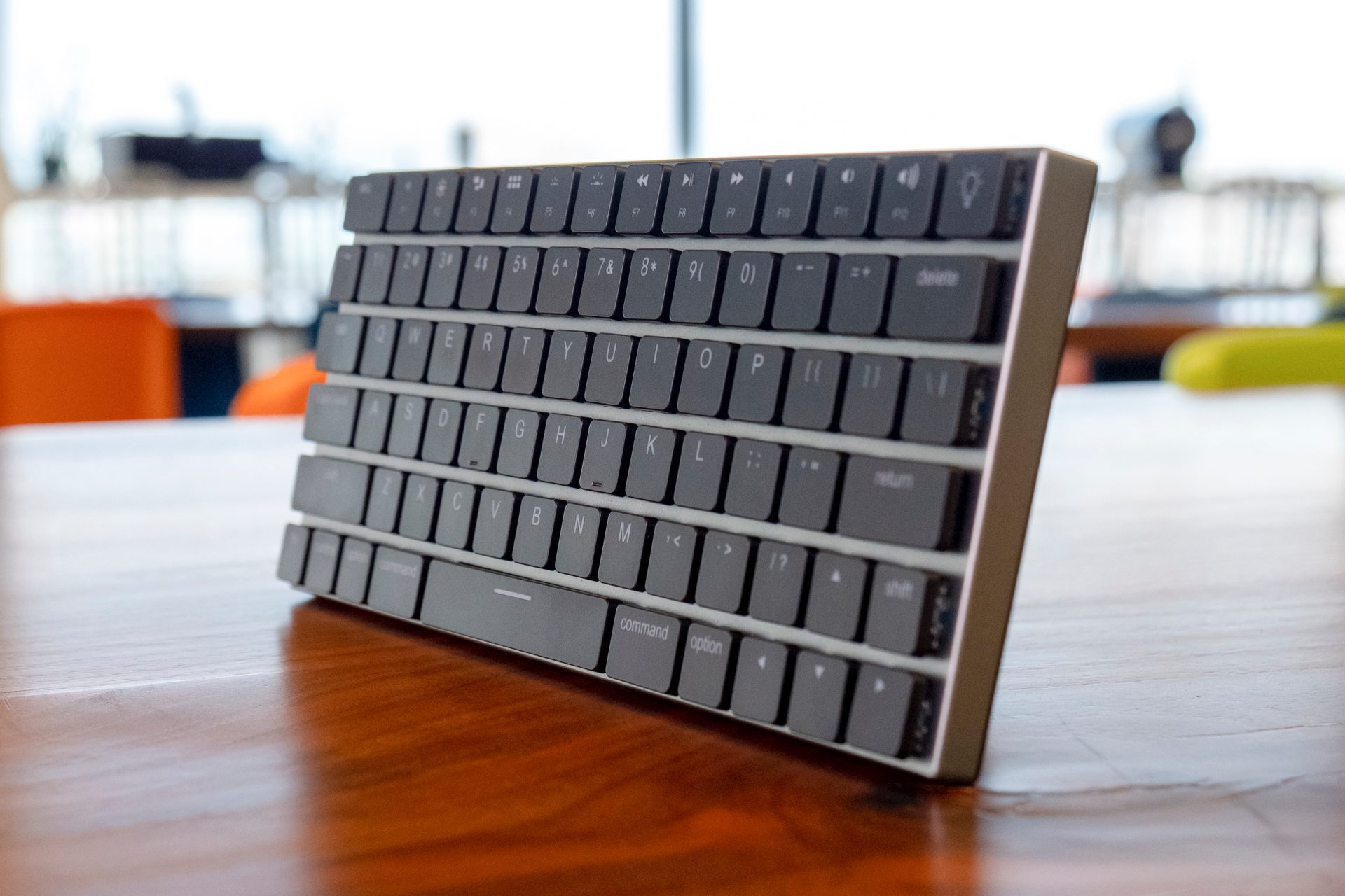 The Vinpok Taptek Keyboard standing upright on a wooden table.