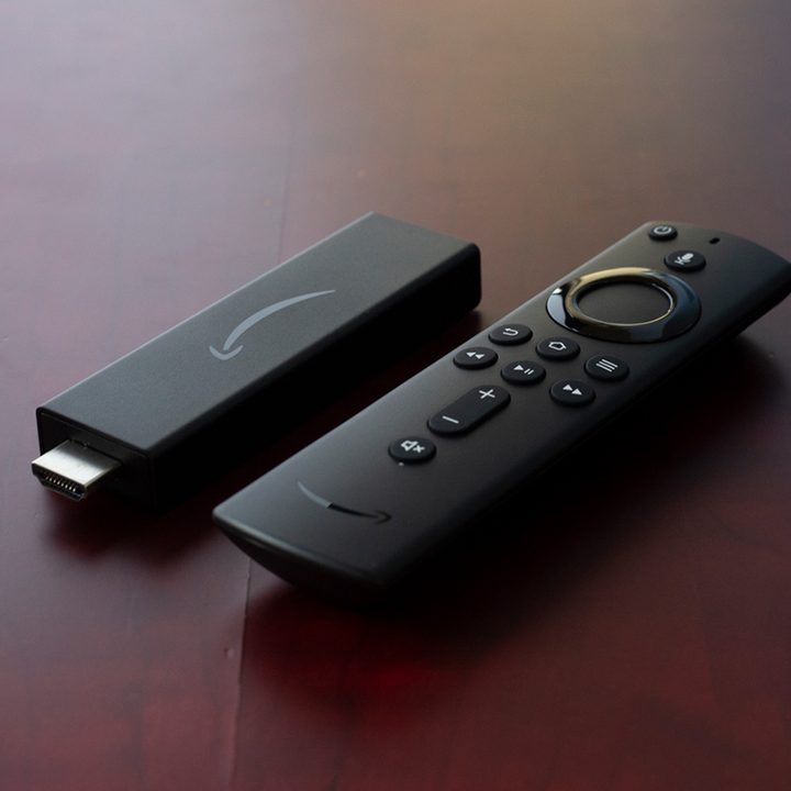 The Amazon Fire TV Streaming Stick 4K on a wooden table.