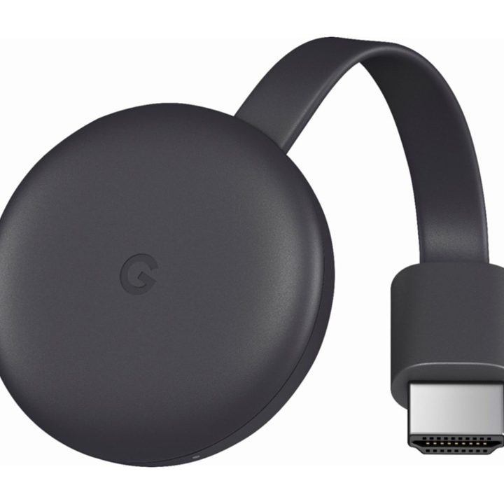 A black Google Chromecast on a white background.