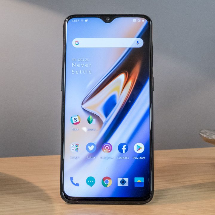 OnePlus 6T phone perched on table.