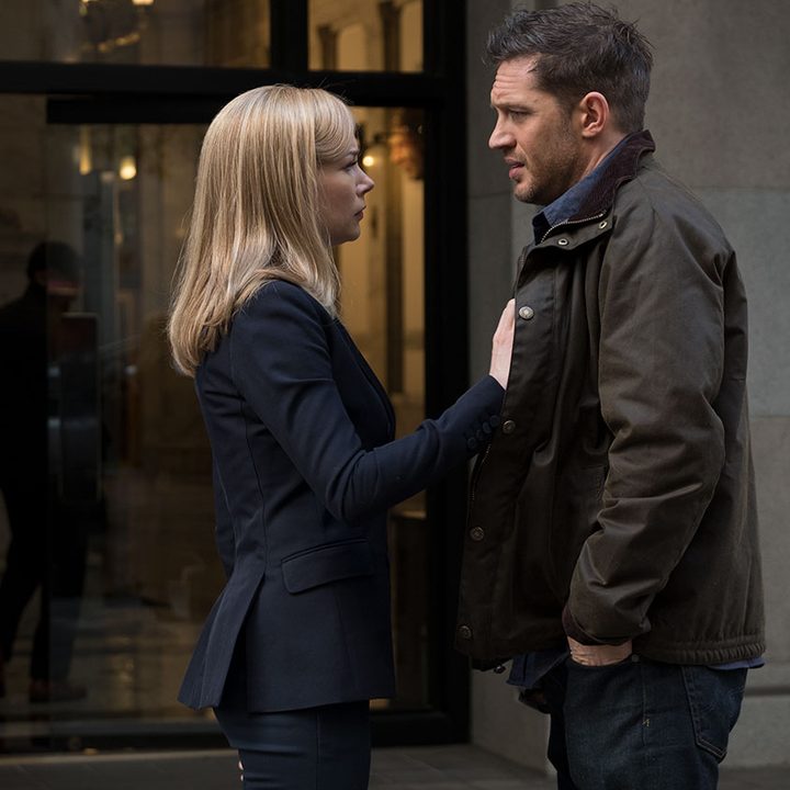 A woman puts her hands on the chest of a man.