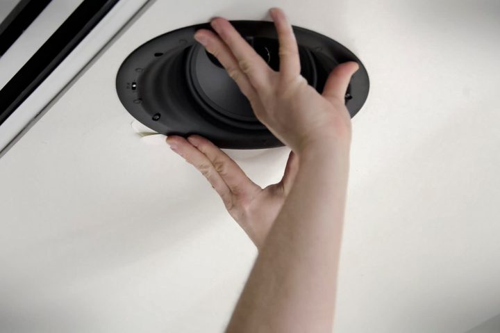 Inserting into ceiling | Install Dolby Atmos ceiling speakers