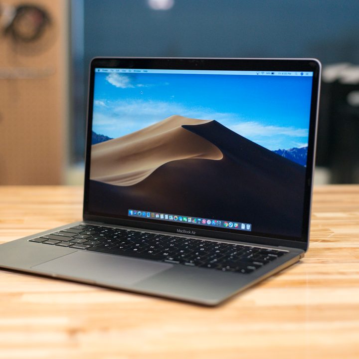 MacBook Air on a desktop displaying the desktop screen.