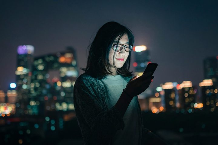 face unlock phone night time woman