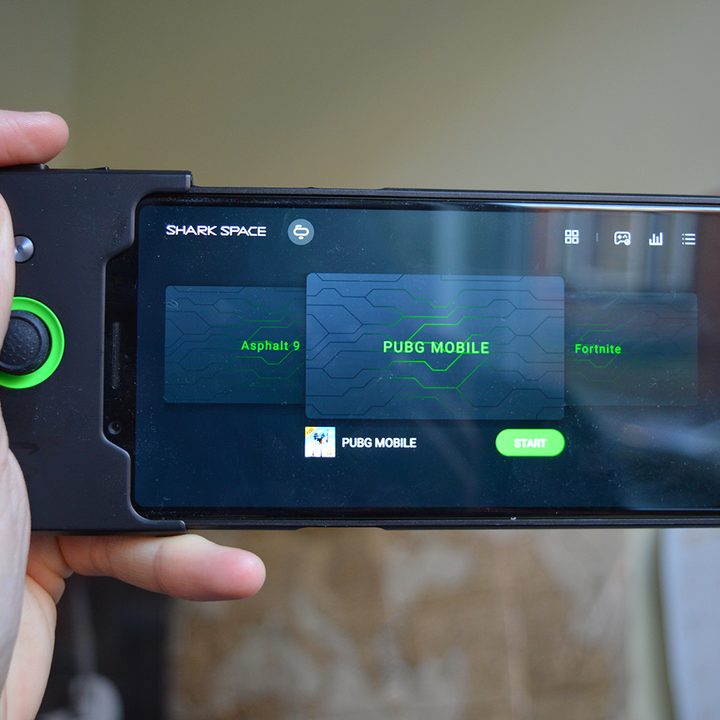 black shark review xiaomi with controller in hand