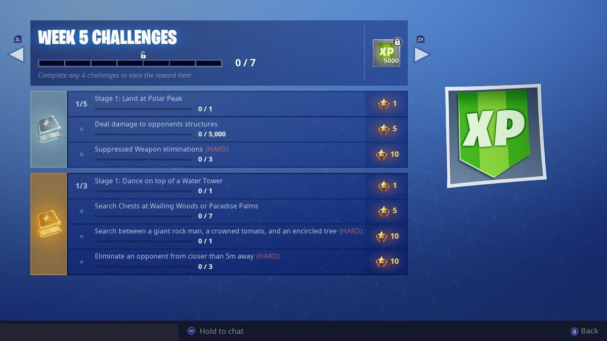 fortnite week 5 challenges search between a giant rock man crowned tomato and encircled tree