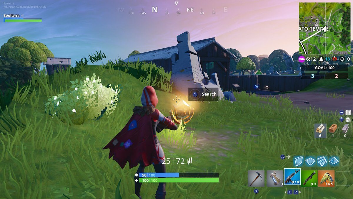 Fortnite Season 7 week 5 challenges search between a giant rock man crowned tomato and encircled tree