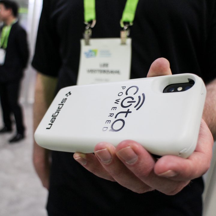 Ossia Spigen wireless charger being held