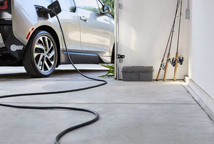 ChargePoint Home EV charger plugged into car.