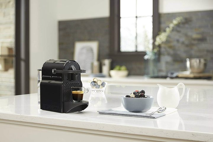 The Nespresso Inissia Espresso Machine on a kitchen counter.