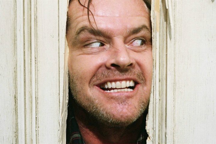 Jack peeks his head through the door in "The Shining."