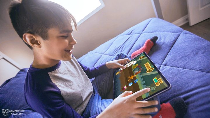 Boy playing Adventure Acadamy