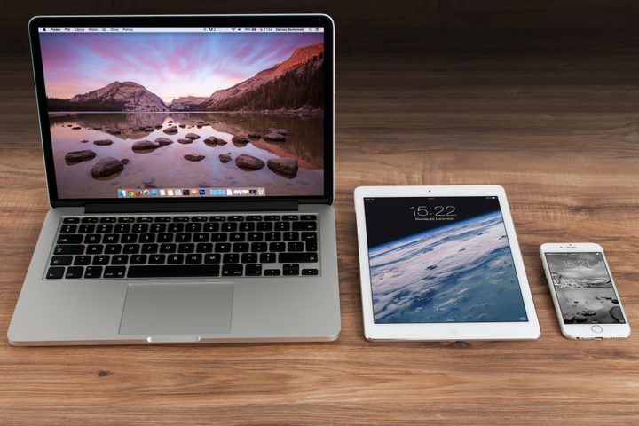 Stock photo of Apple products sitting on a desk