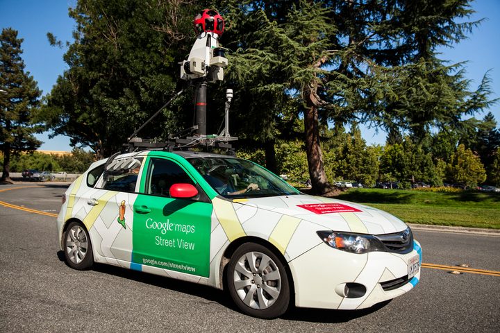 Google street view car with pollution sensing tech driving