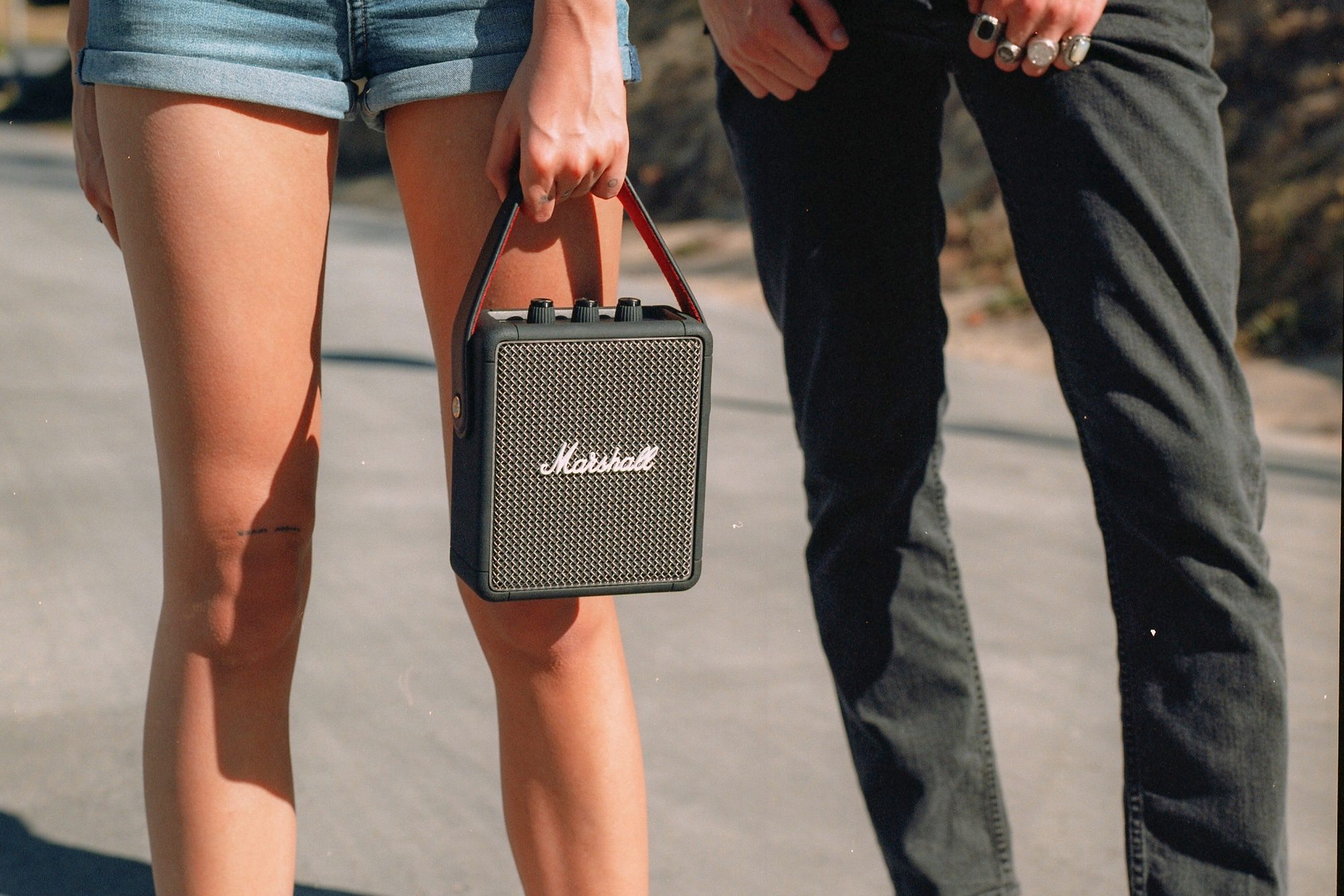 Carrying the Marshall Stockwell II portable Bluetooth speaker at an event.