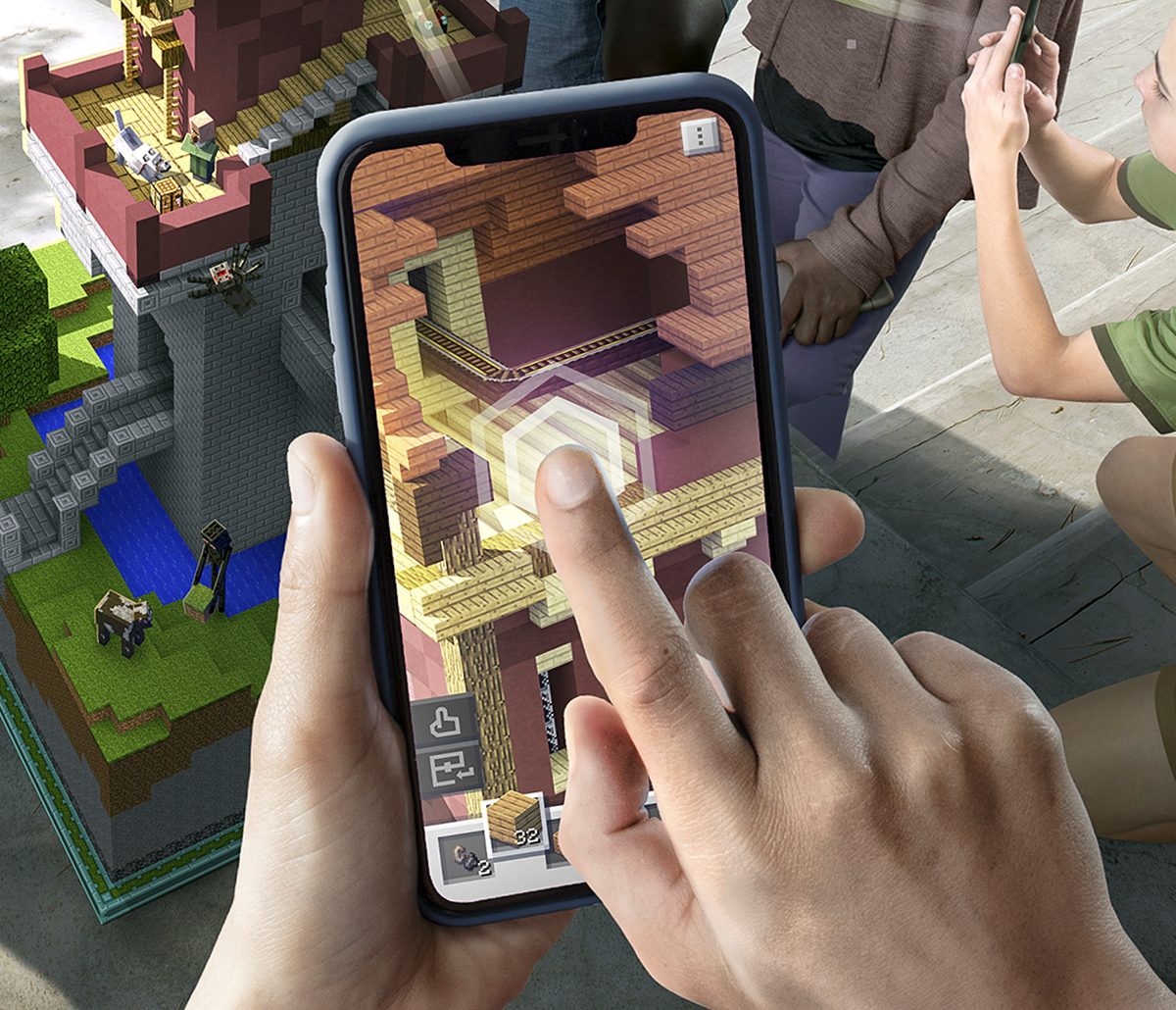 Player Placing Block in App on Phone Screen | Minecraft Earth Key Art