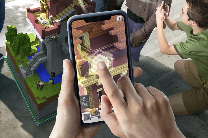 Player Placing Block in App on Phone Screen | Minecraft Earth Key Art