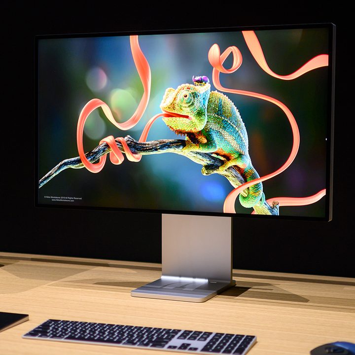 The Apple Pro Display XDR monitor next to a Mac Pro.