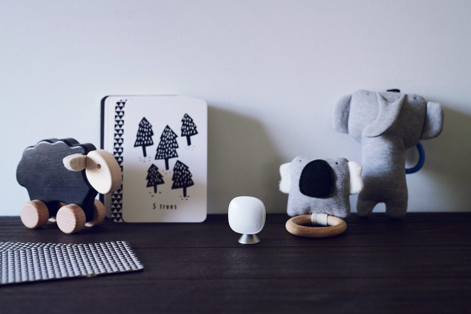 An Ecobee sensor on a table.