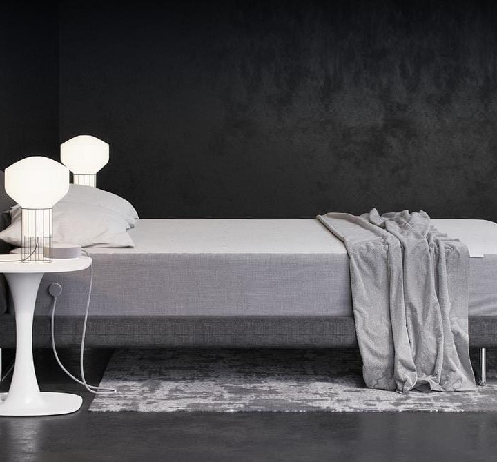 The Nest Hub system beside a bed.