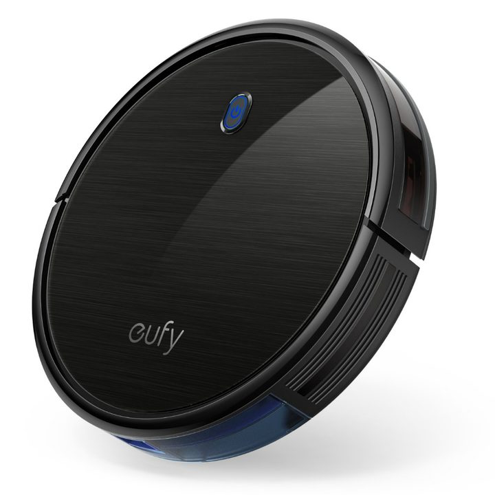 The slim version of the Eufy BoostIQ RoboVac 11s, with the power button glowing faintly. 