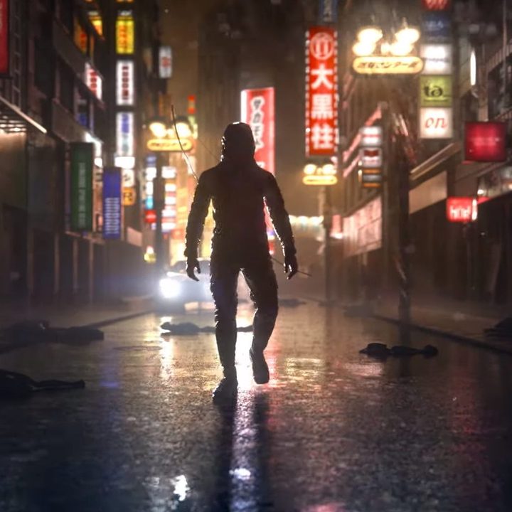 The main character of Ghostwire: Tokyo walks down a city street.