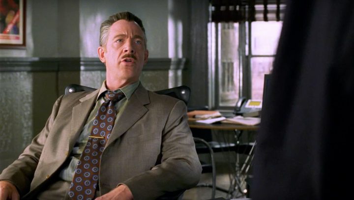 J. Jonah Jameson sitting back on his chair in Spider-Man.