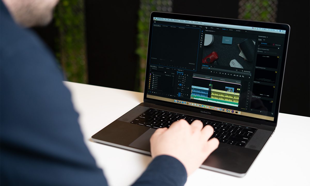 A man working on a 2019 Macbook pro 15.