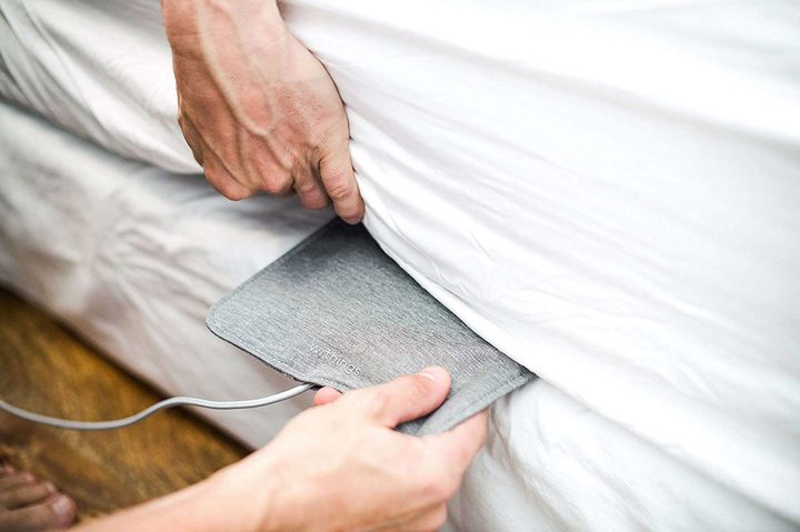 The Withings Sleep device being installed.