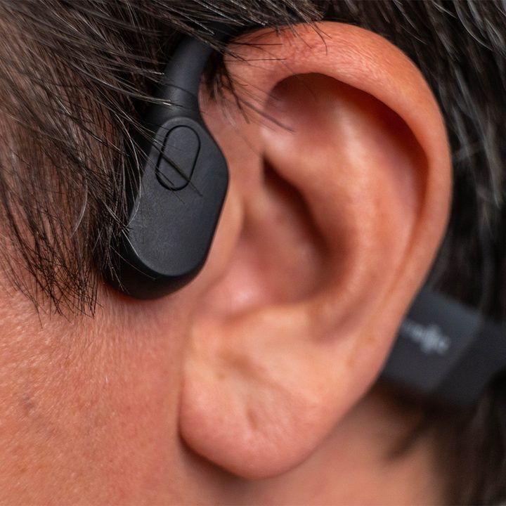Man wearing bone-conducting headphones.